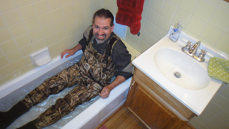 David Kish testing his waders before his first Duck hunt.