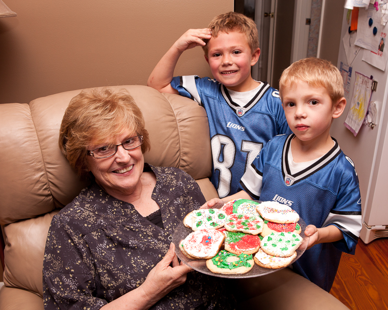 Dian Crites, Grant & David Kish show off their homemade Christmas cookies.