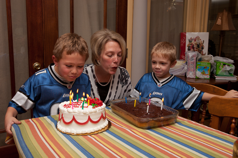 Grant , Leigh & David Kish blow out the candles.