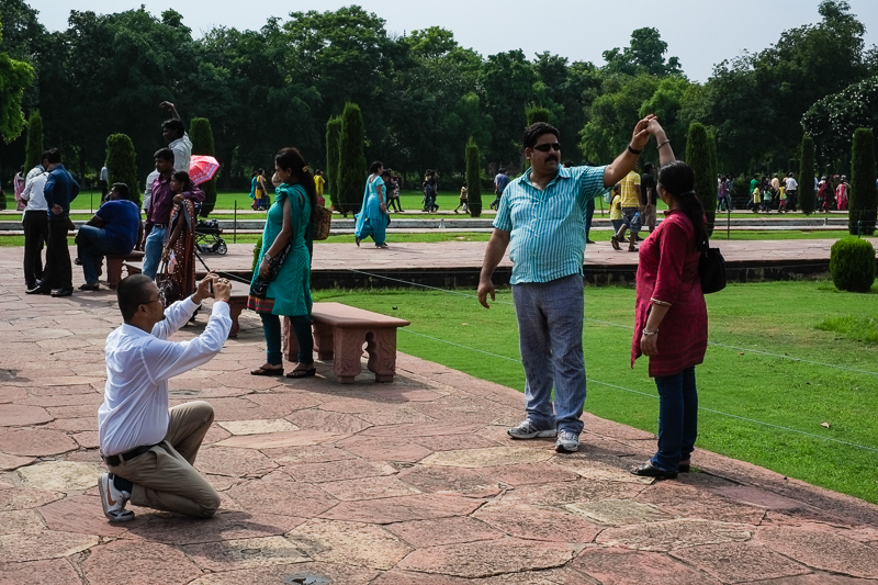 Tourists having their picture taken at Taj Mahal