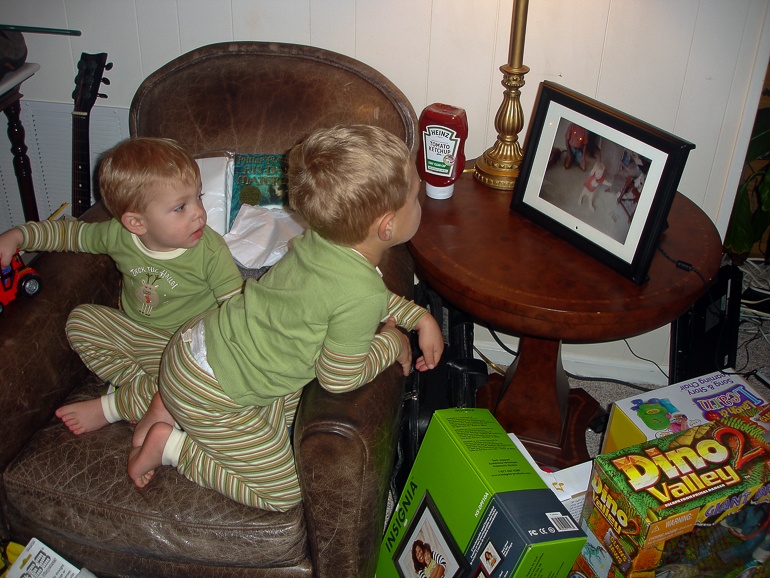 David & Grant Kish watching the digital picture frame.