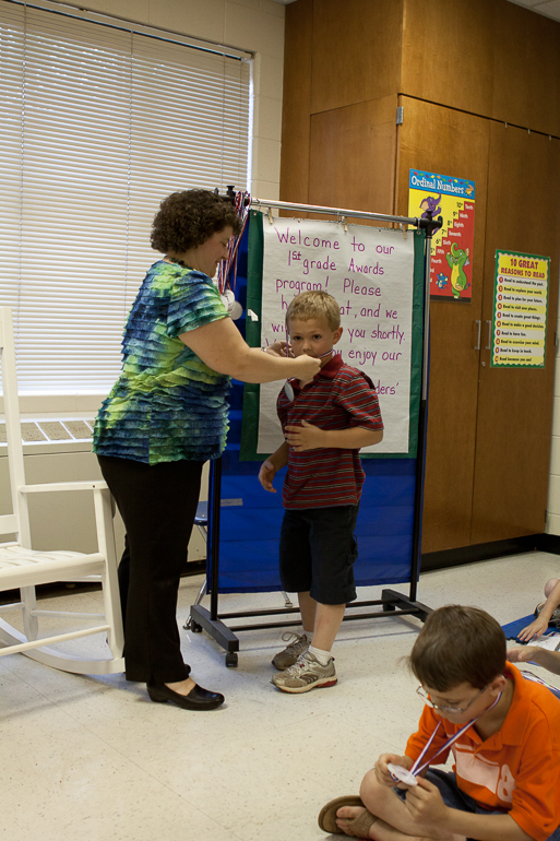 Grant Kish receiving his medal for progressing to 2nd grade.